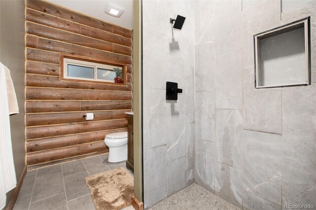 57 Overlook Ct, Idaho Springs, CO 80452 - full bath featuring rustic walls, a tile shower, and tile patterned floors