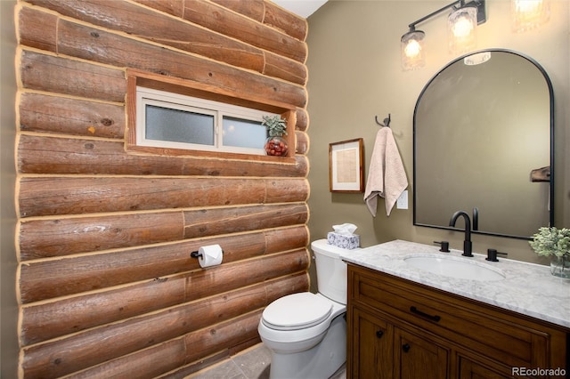 57 Overlook Ct, Idaho Springs, CO 80452 - bathroom featuring vanity and log walls