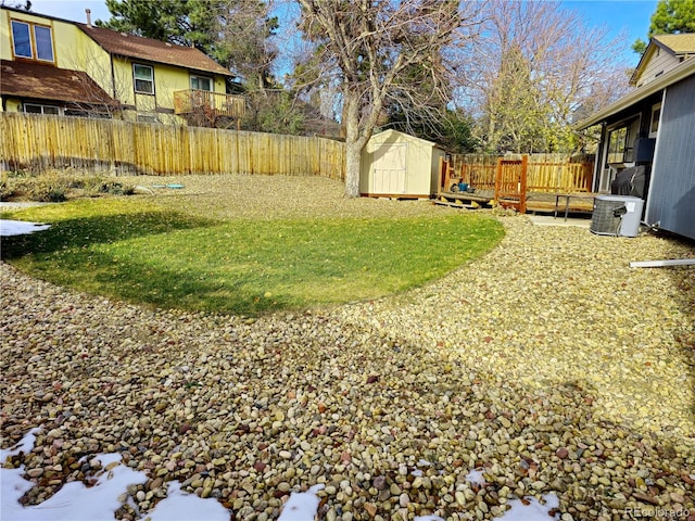 view of yard with a storage unit and cooling unit