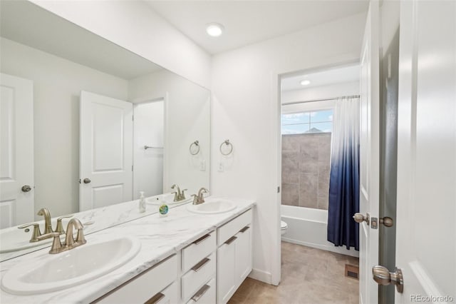 full bathroom with vanity, toilet, tile patterned flooring, and shower / bath combo