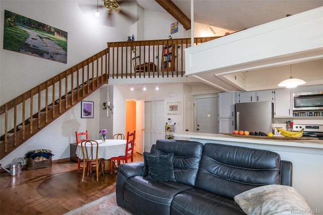 3300 W Florida Ave Unit 37, Denver, CO 80219 - living area featuring stairway, wood finished floors, high vaulted ceiling, beamed ceiling, and a ceiling fan