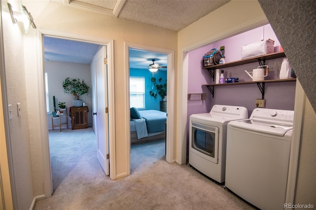 3300 W Florida Ave Unit 37, Denver, CO 80219 - laundry area featuring independent washer and dryer, light carpet, and a textured ceiling