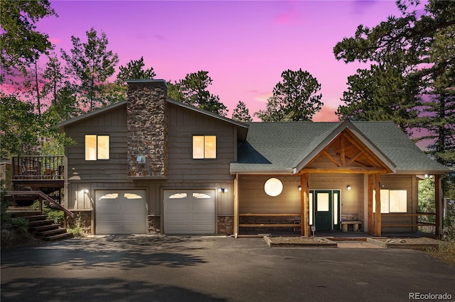 view of front of house featuring a garage and a porch