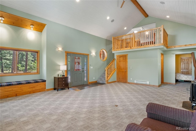 carpeted living area featuring beam ceiling, a baseboard radiator, stairway, high vaulted ceiling, and baseboards