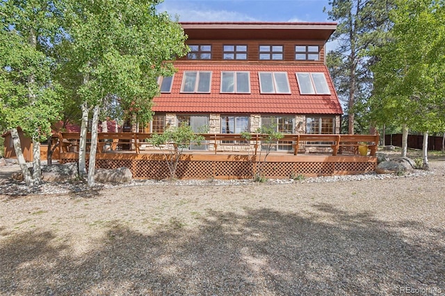 view of front of house featuring a wooden deck