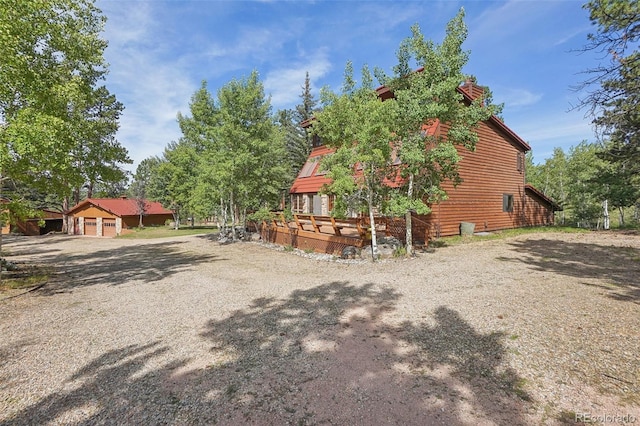 view of side of home featuring a garage