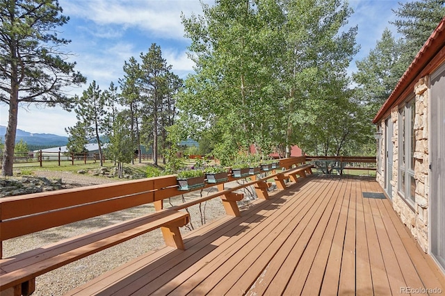 wooden terrace featuring a mountain view