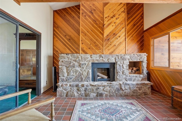 living room featuring wood walls and tile patterned floors