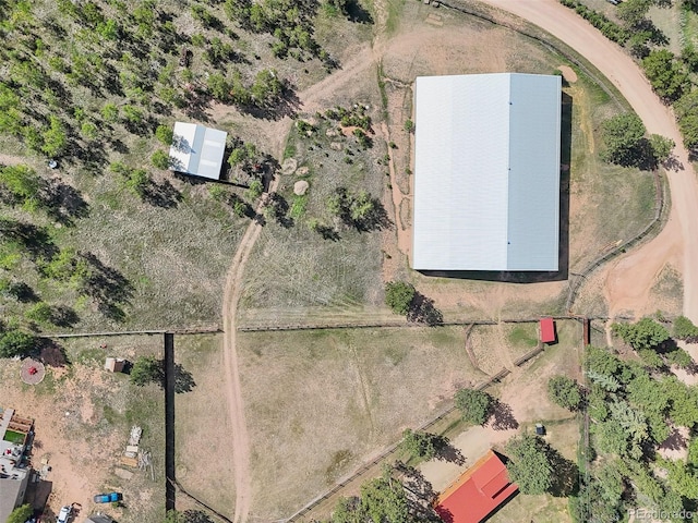 birds eye view of property with a rural view