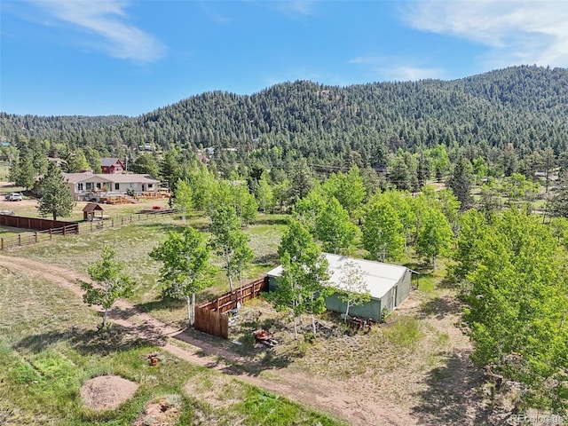 birds eye view of property with a mountain view and a rural view