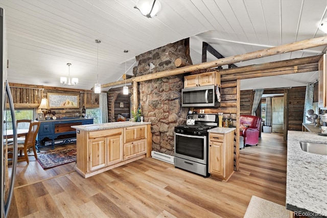 104 County Road 90, Allenspark, CO 80510 - kitchen featuring stainless steel appliances, lofted ceiling, light brown cabinetry, a peninsula, and light wood-type flooring