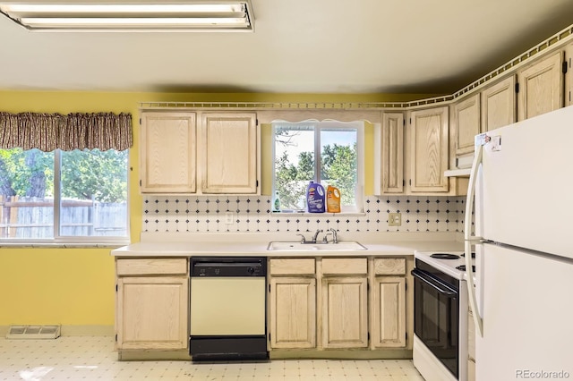 7542 Otis St, Arvada, CO 80003 - kitchen featuring white appliances, light countertops, and plenty of natural light