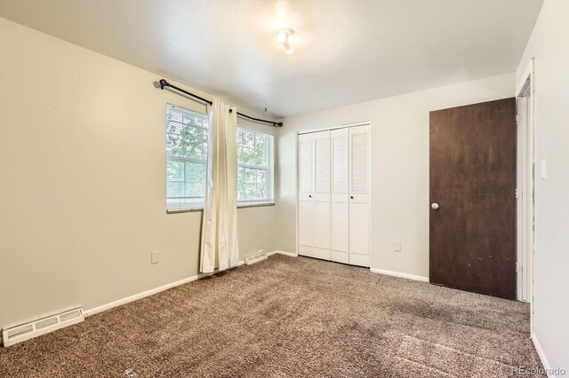 7542 Otis St, Arvada, CO 80003 - unfurnished bedroom with carpet flooring and baseboards