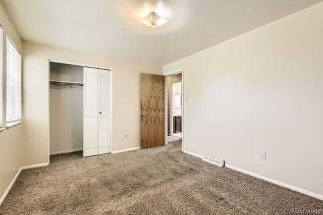7542 Otis St, Arvada, CO 80003 - unfurnished bedroom featuring carpet flooring and a closet