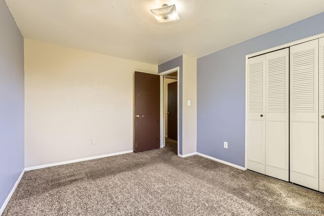 7542 Otis St, Arvada, CO 80003 - unfurnished bedroom featuring carpet flooring and a closet