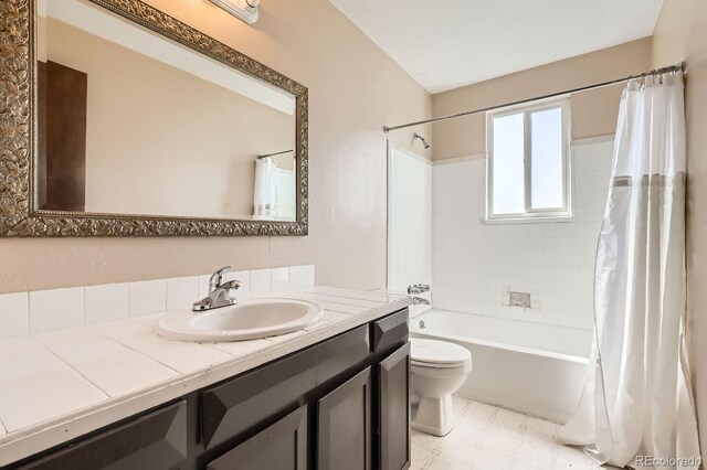 7542 Otis St, Arvada, CO 80003 - full bath with vanity, shower / bath combo, and tile patterned floors