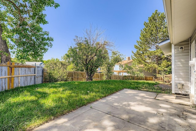 7542 Otis St, Arvada, CO 80003 - fenced backyard featuring a patio area