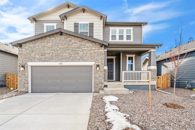 13402 E 110th Way, Commerce City, CO 80022 - craftsman-style home with a porch, stone siding, concrete driveway, and a garage