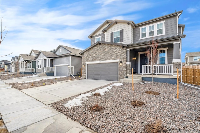 13402 E 110th Way, Commerce City, CO 80022 - craftsman house with covered porch, stone siding, driveway, and a residential view