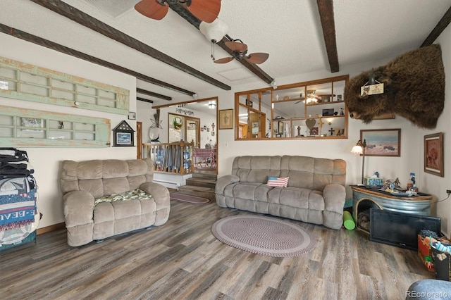 12101 Riverdale Rd, Brighton, CO 80602 - living room featuring a ceiling fan, beam ceiling, and wood finished floors