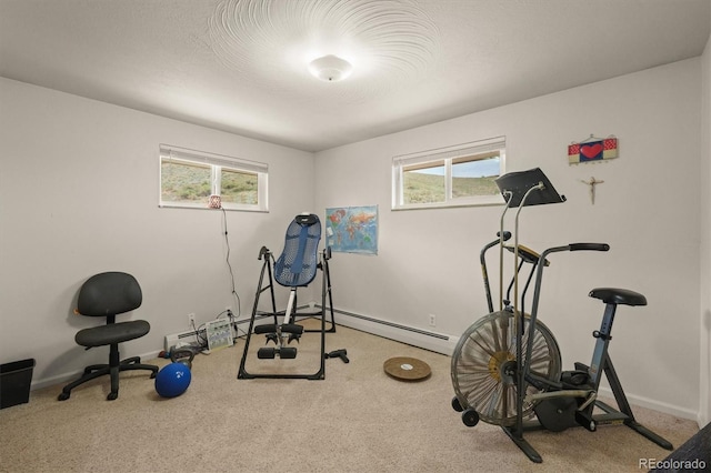 12101 Riverdale Rd, Brighton, CO 80602 - workout area featuring carpet, healthy amount of natural light, and a baseboard heating unit