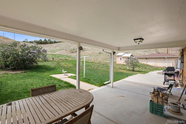 12101 Riverdale Rd, Brighton, CO 80602 - view of patio / terrace featuring grilling area and outdoor dining area