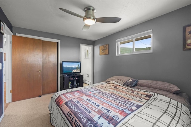 12101 Riverdale Rd, Brighton, CO 80602 - bedroom with a closet, a baseboard radiator, carpet, and a ceiling fan