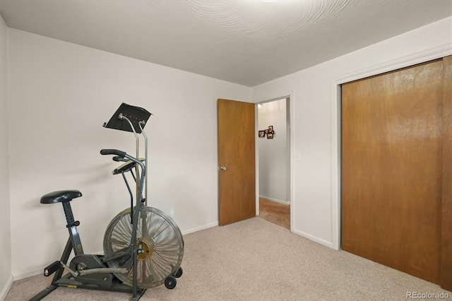 12101 Riverdale Rd, Brighton, CO 80602 - workout room featuring carpet flooring and baseboards
