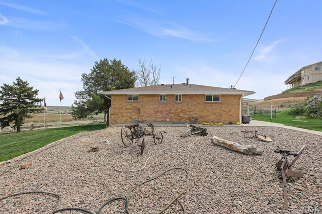 12101 Riverdale Rd, Brighton, CO 80602 - rear view of property featuring brick siding