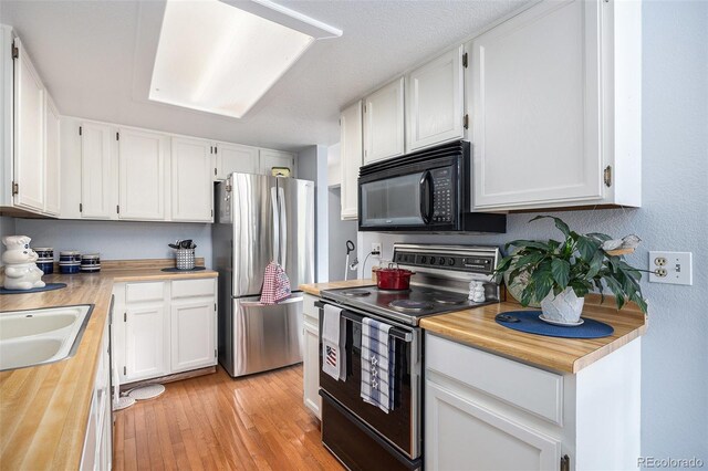 60 S Moline St, Aurora, CO 80012 - kitchen featuring black appliances and white cabinetry