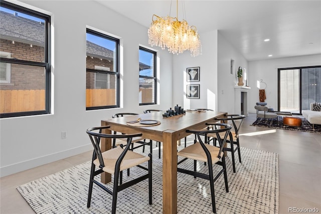 tiled dining space with an inviting chandelier