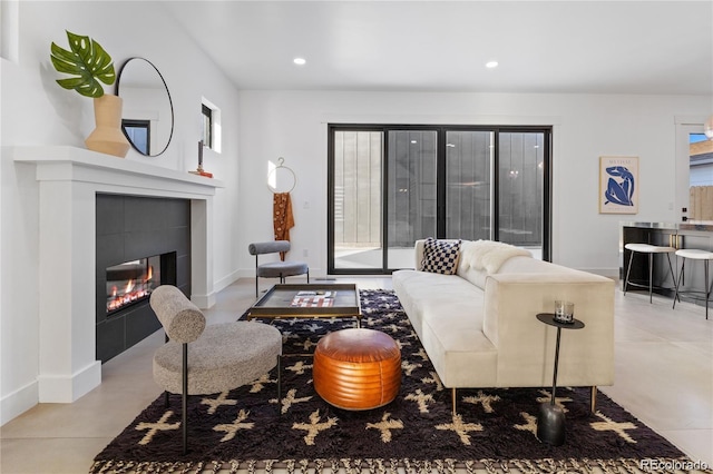 living room featuring a fireplace and a wealth of natural light