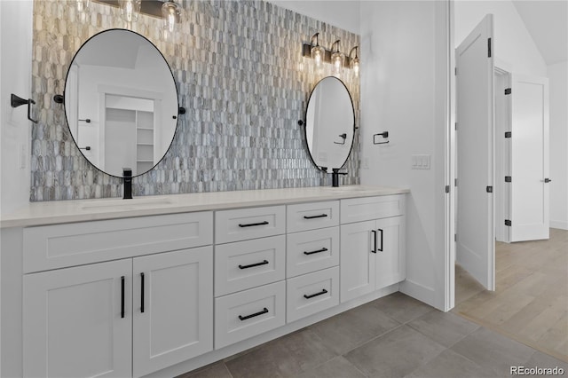 bathroom featuring hardwood / wood-style flooring and vanity