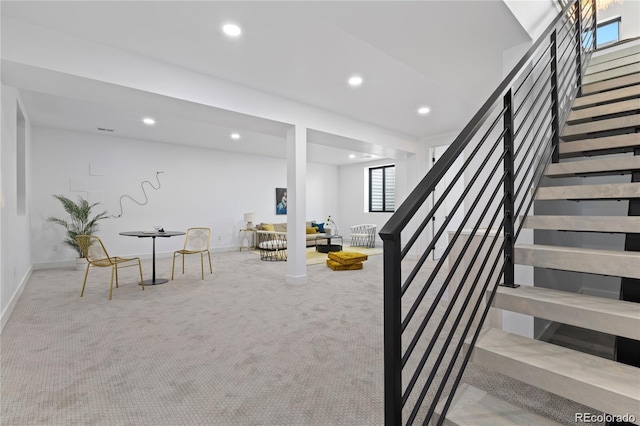 stairs featuring carpet floors and plenty of natural light