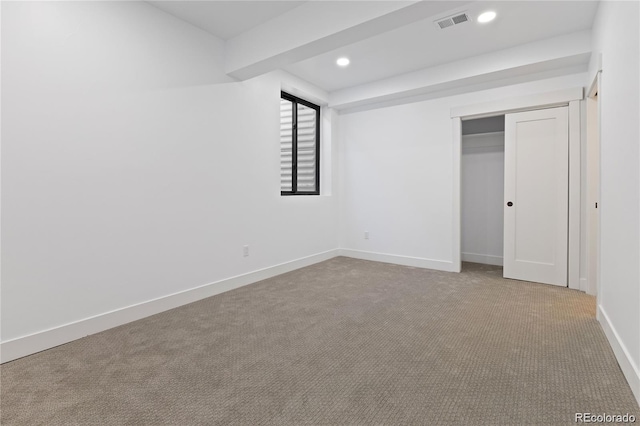 unfurnished bedroom with carpet and a closet