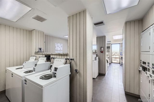 laundry area featuring separate washer and dryer and stacked washer and dryer