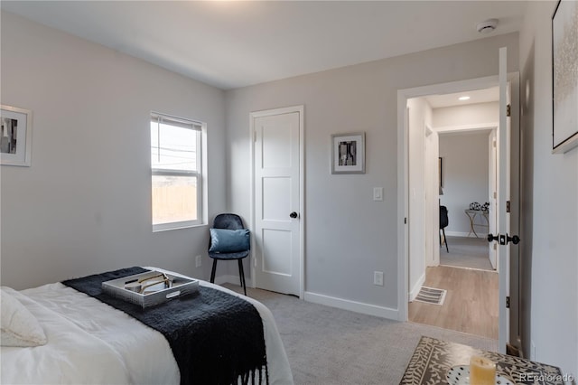 bedroom with light carpet