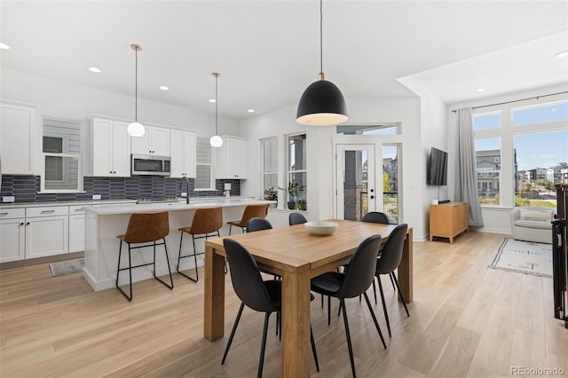 dining area featuring light hardwood / wood-style floors and french doors