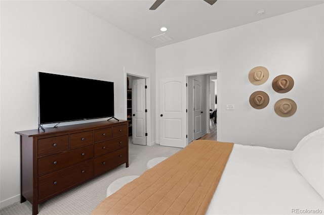 bedroom featuring light carpet and ceiling fan