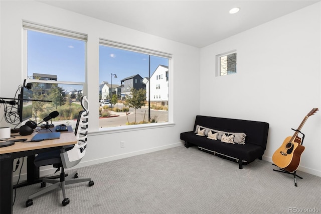 carpeted office space with a wealth of natural light