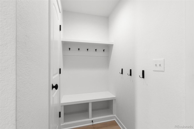 mudroom with hardwood / wood-style flooring