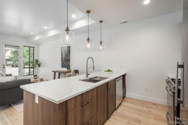 521 21st St, Golden, CO 80401 - kitchen with light wood-style floors, a peninsula, modern cabinets, open floor plan, and recessed lighting