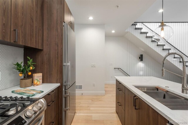 521 21st St, Golden, CO 80401 - kitchen featuring light wood-type flooring, modern cabinets, light countertops, freestanding refrigerator, and recessed lighting