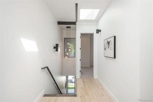 521 21st St, Golden, CO 80401 - corridor featuring an upstairs landing, a skylight, and light wood-style flooring