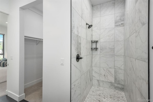 521 21st St, Golden, CO 80401 - bathroom with a tile shower, connected bathroom, and a walk in closet