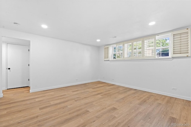 unfurnished room with light hardwood / wood-style flooring