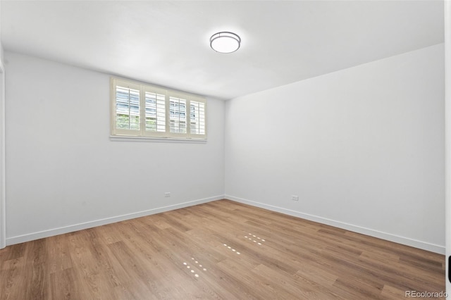 unfurnished room featuring hardwood / wood-style floors