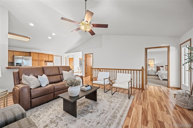 2226 Lily Dr, Loveland, CO 80537 - living area featuring vaulted ceiling, a ceiling fan, light wood-style flooring, and recessed lighting