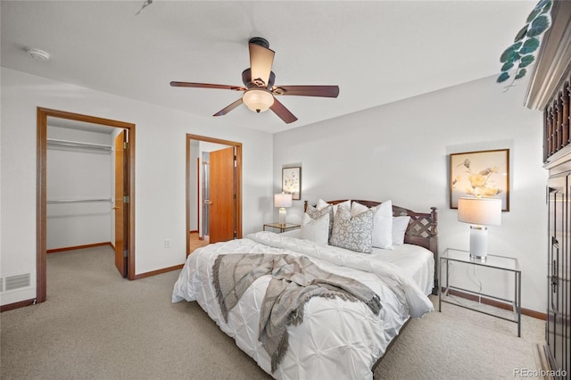 2226 Lily Dr, Loveland, CO 80537 - carpeted bedroom featuring a spacious closet, baseboards, ceiling fan, and a closet