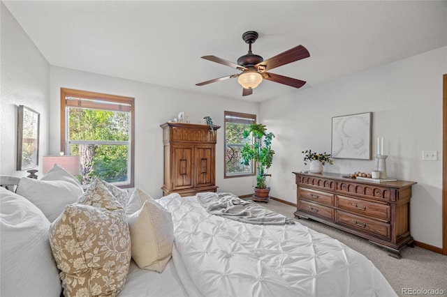 2226 Lily Dr, Loveland, CO 80537 - bedroom featuring light colored carpet, baseboards, and a ceiling fan